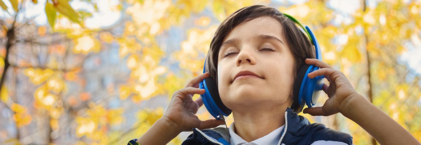 Image of child listening to music